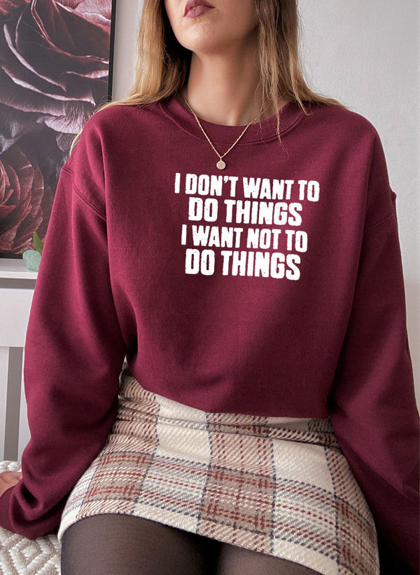 I Dont Want To Do Things Sweat Shirt worn by a woman, featuring a stylish burgundy color and printed text design.