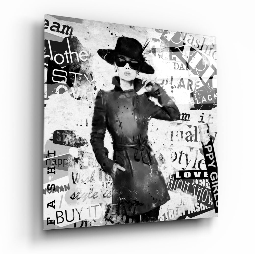 Fashion Glass Wall Art featuring a stylish woman in a trench coat on a textured background with fashion-related words.