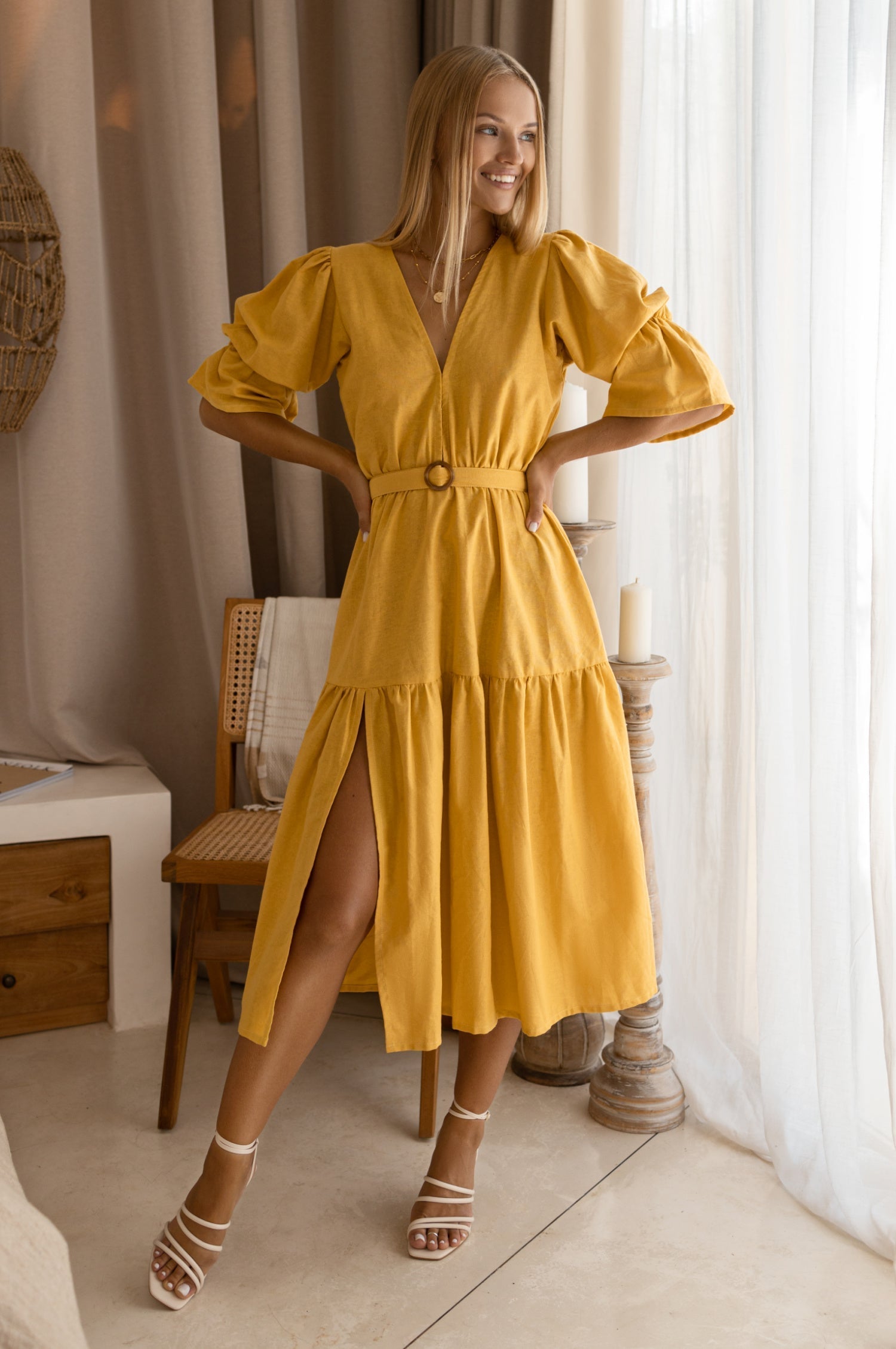 Peony Midi Dress (Sale) in a sunny yellow color with gathered puff sleeves and a flattering a-line silhouette.