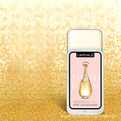 NNETM Portable Pocket Balm Solid Travel Perfume Men Women in elegant packaging against a sparkling gold background.