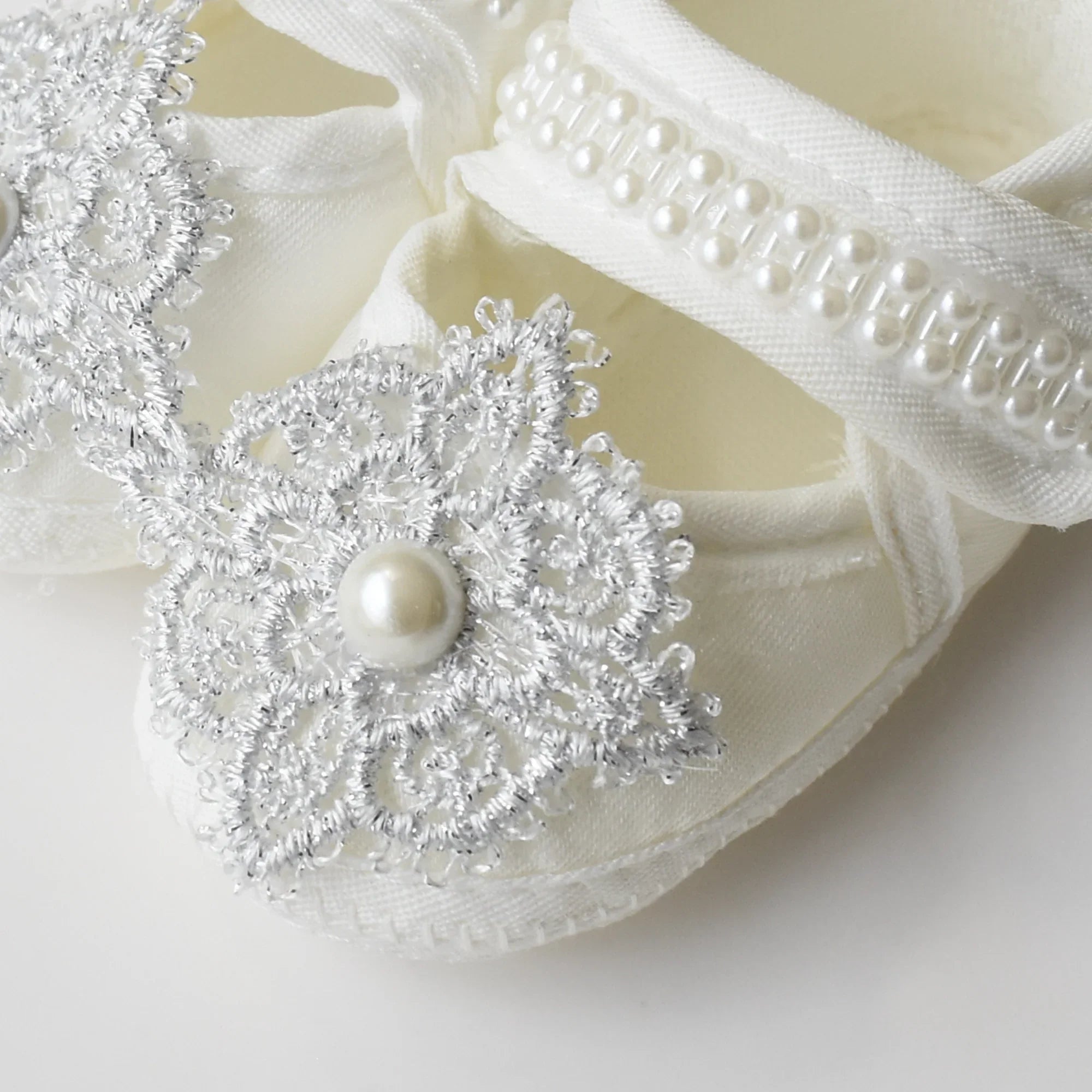 Baby Bliss Baby Shoes Set featuring elegant silver lace and pearl embellishments on soft baby shoes.