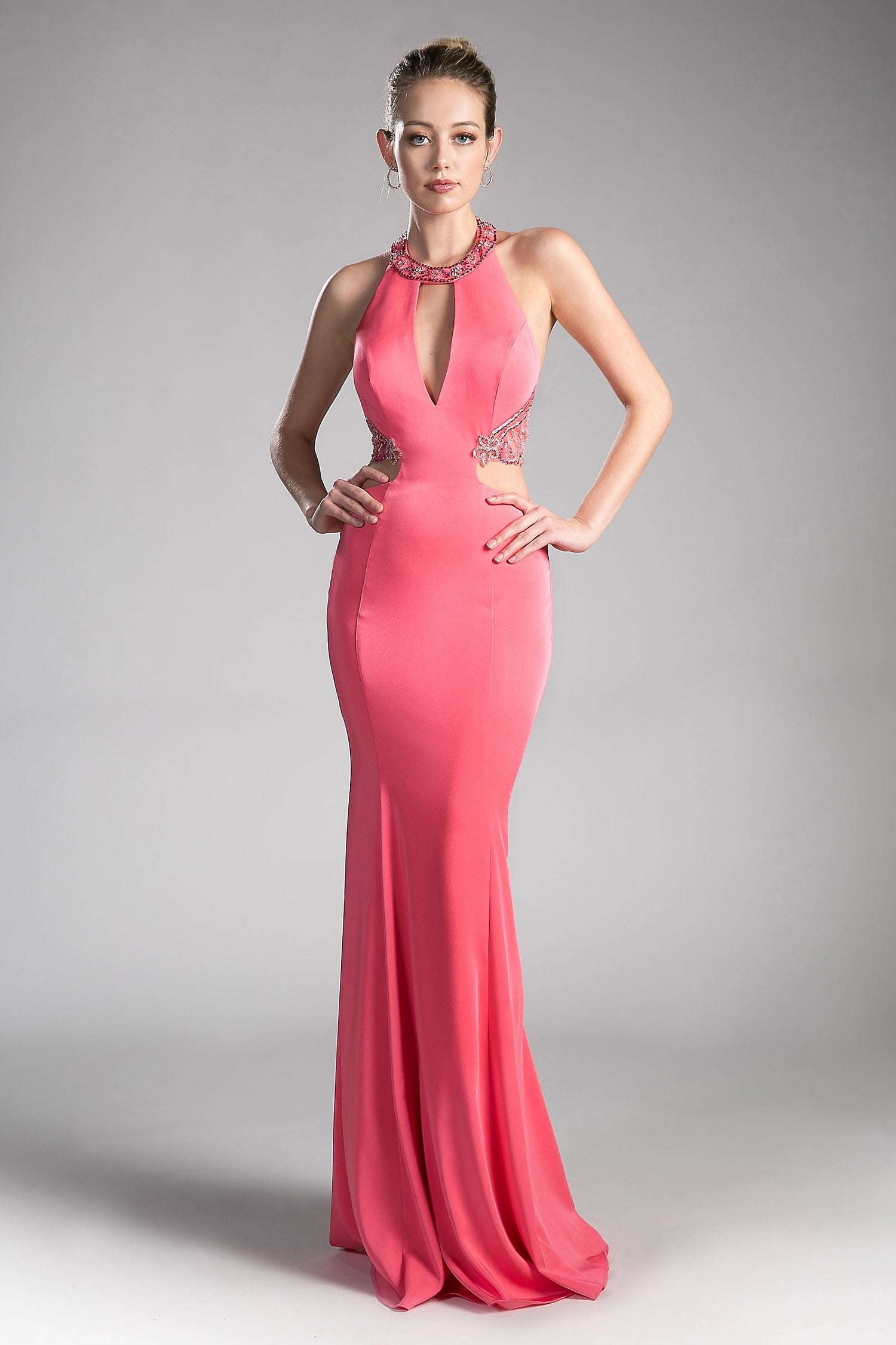 Fitted Stretch Jersey Gown with Halter Neckline and Cut Outs in pink with chic cut outs and embellishments.