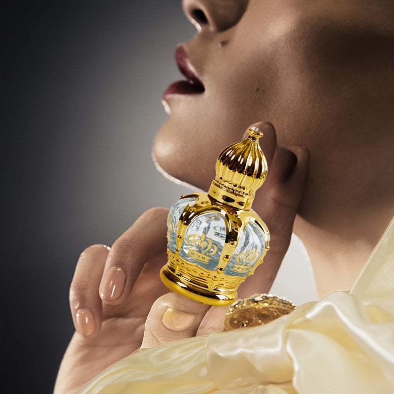 Roller Perfume Oil Long Lasting Floral Fragrance in an elegant gold crown bottle held by a model.