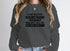 A Day Without Sarcasm Sweat Shirt featuring humorous text design, perfect for elevating winter style.