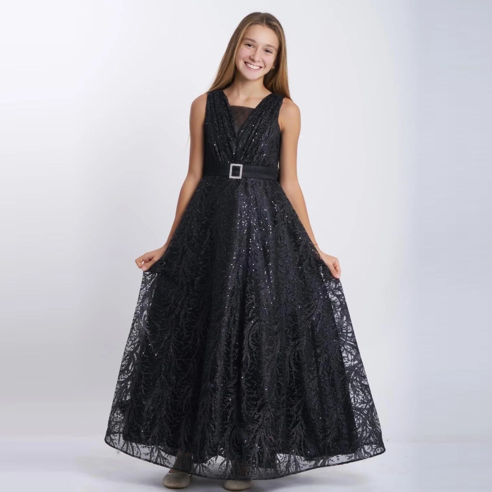 Sparkling Beauty Girls Formal Dress worn by a smiling girl in a stunning black long tulle gown with sparkles.