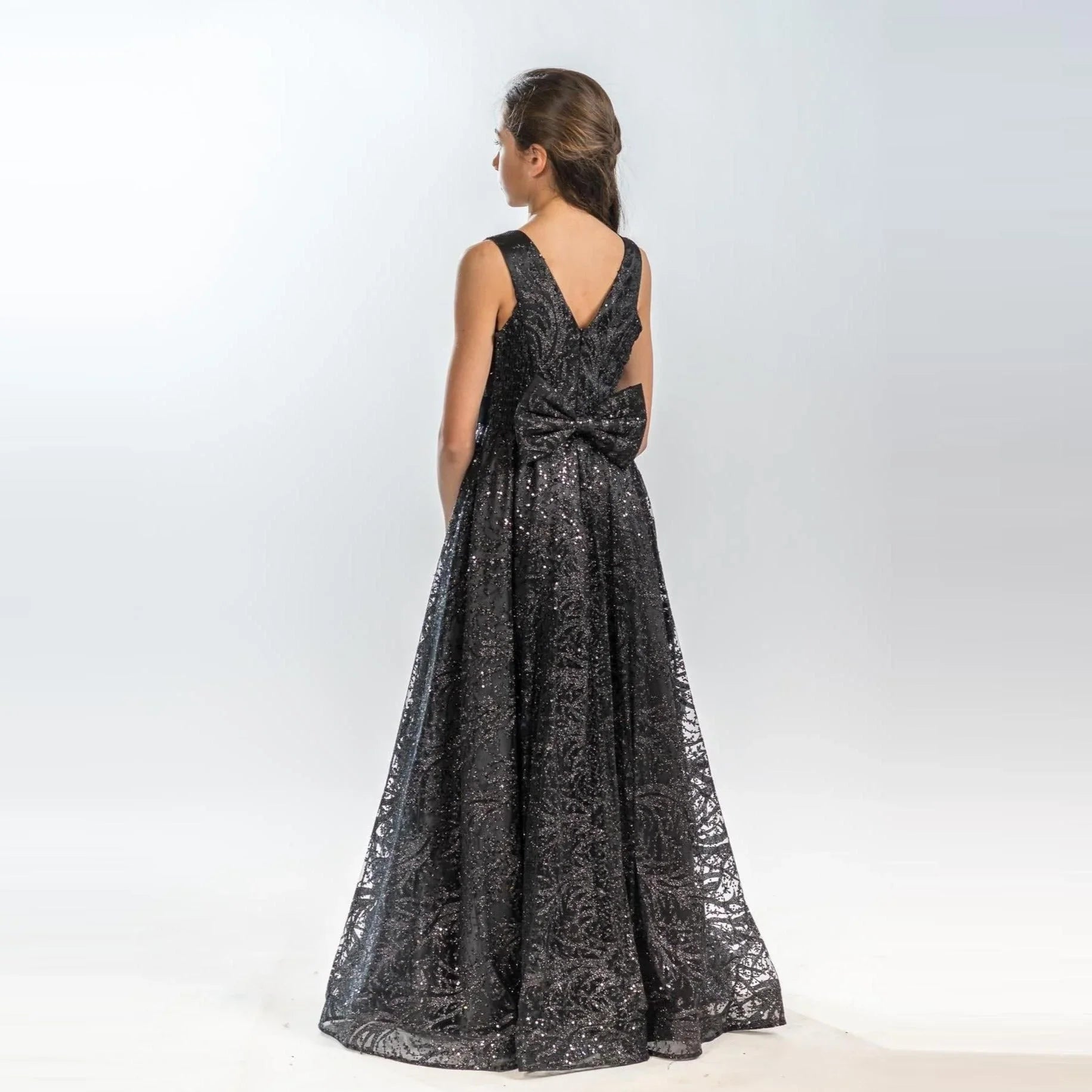 Sparkling Beauty Girls Formal Dress showcased from the back, featuring a stunning design with a large bow detail.