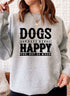 Woman wearing Dogs Make Happy Sweat Shirt with a playful design in grey.
