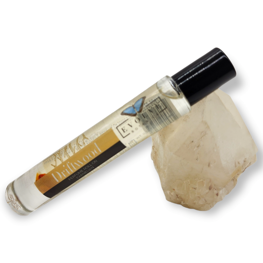 Gemstone Perfume Roll On - Driftwood bottle next to crystal, showcasing its soothing scent blend.