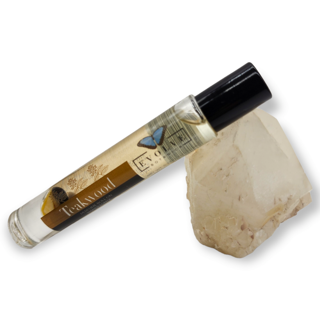 Gemstone Perfume Roll On - Teakwood bottle beside a quartz crystal for aromatherapy.