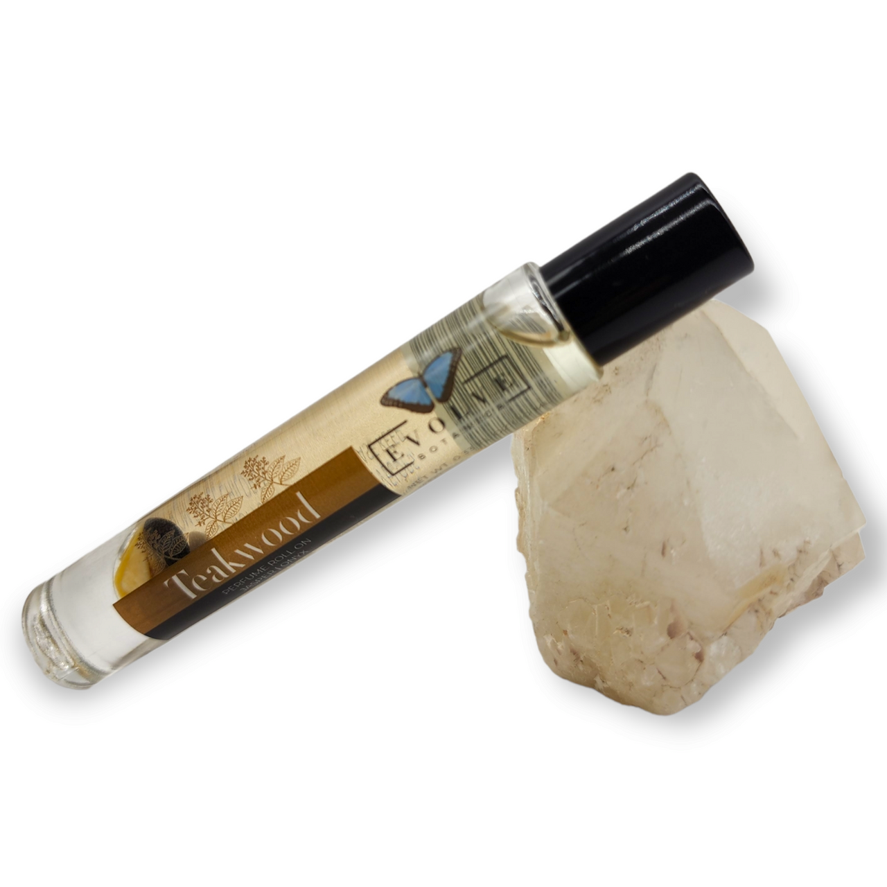 Gemstone Perfume Roll On - Teakwood bottle beside a quartz crystal for aromatherapy.