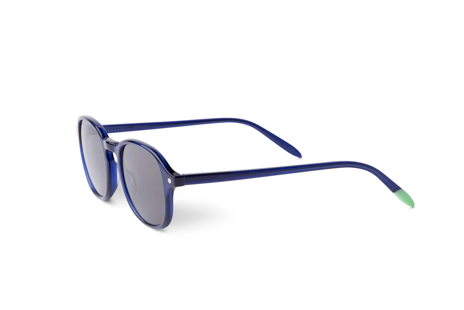 Blue round sunglasses with gray lenses and green-tipped arms on white background