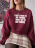 I Dont Want To Do Things Sweat Shirt worn by a woman, featuring a stylish burgundy color and printed text design.