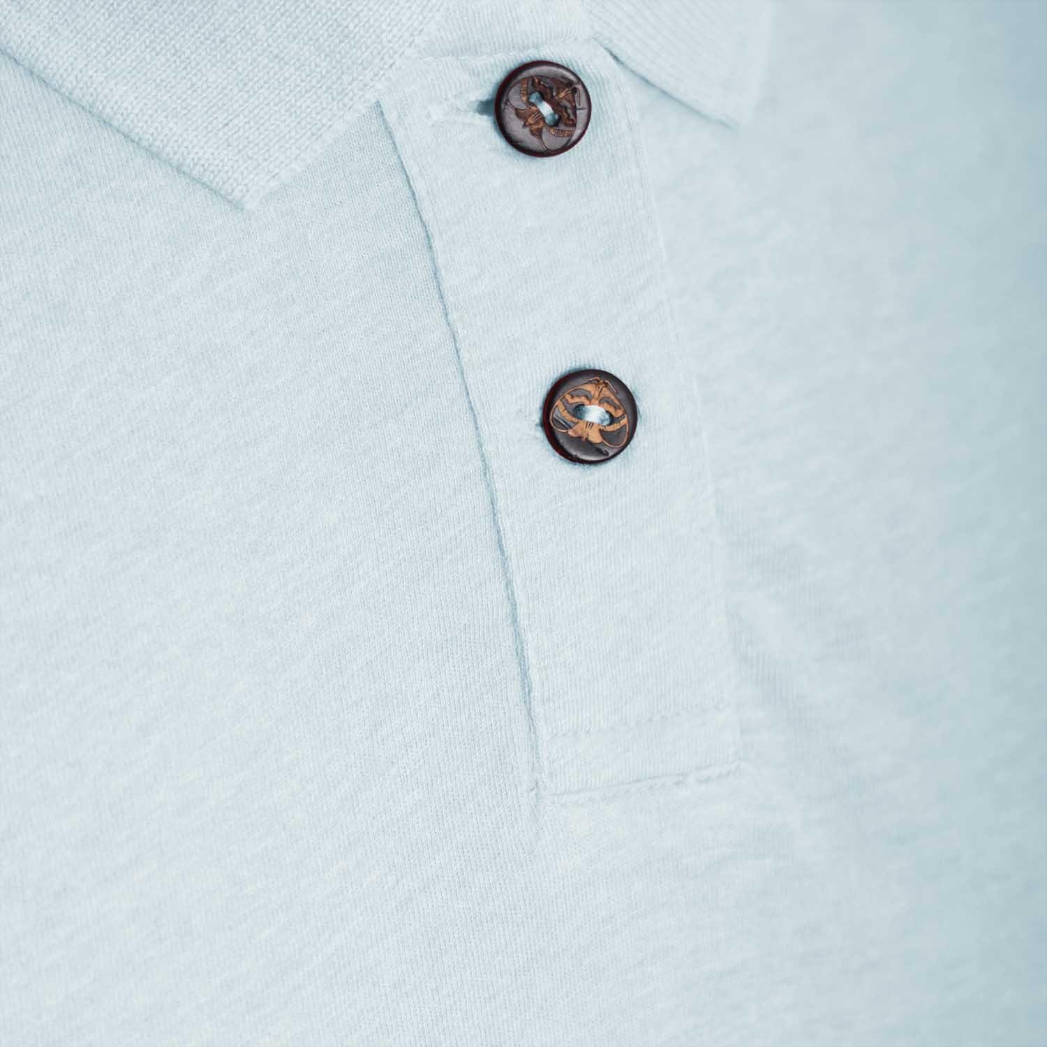 Close-up of buttons on a Mint Green Girls Polo Dress, showcasing its soft fabric and stylish design.