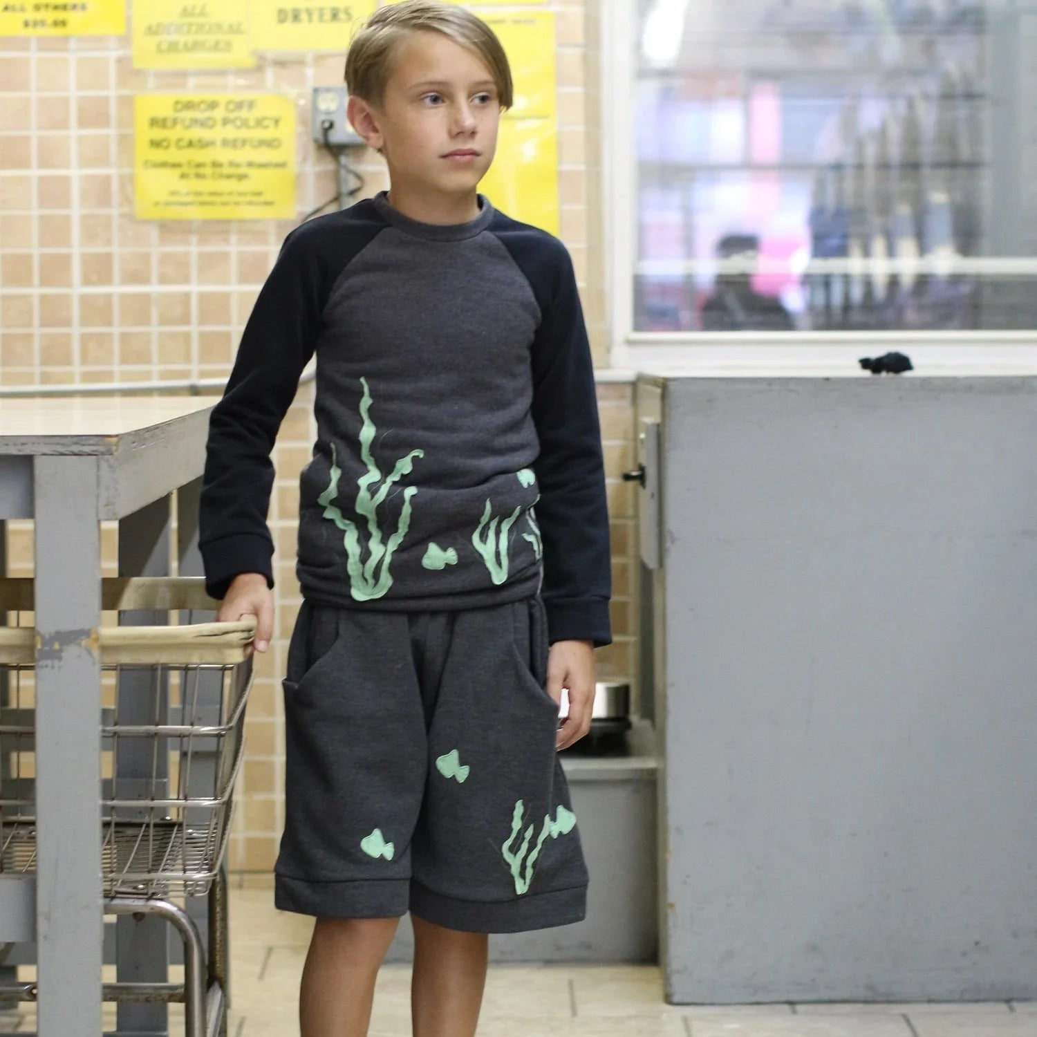 Sweatshirt with Marine Application worn by a child, featuring playful marine designs, paired with matching culottes shorts.