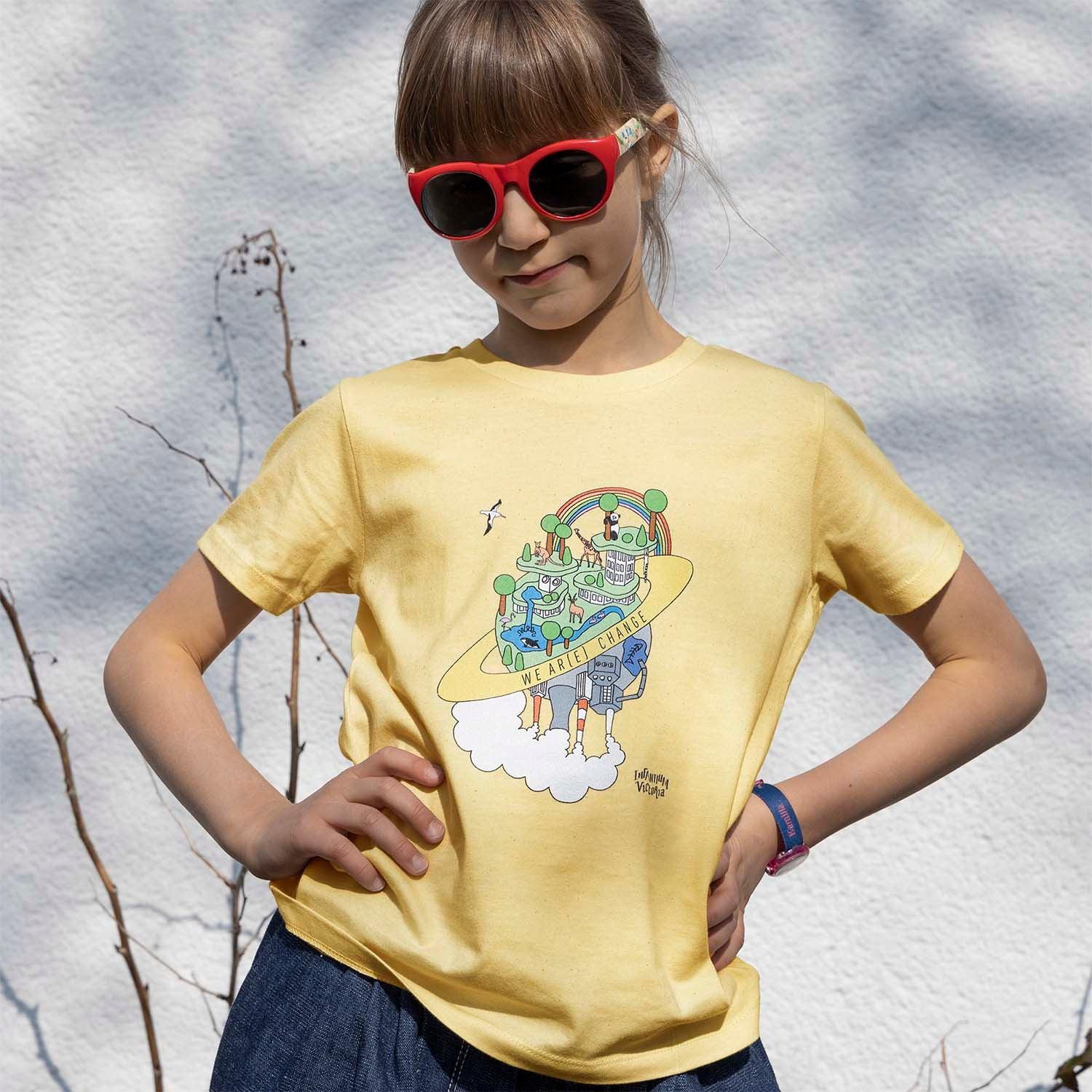 Graphic T Shirts for Boys and Girls - Earth Day Print worn by a girl in yellow, showcasing a playful design.