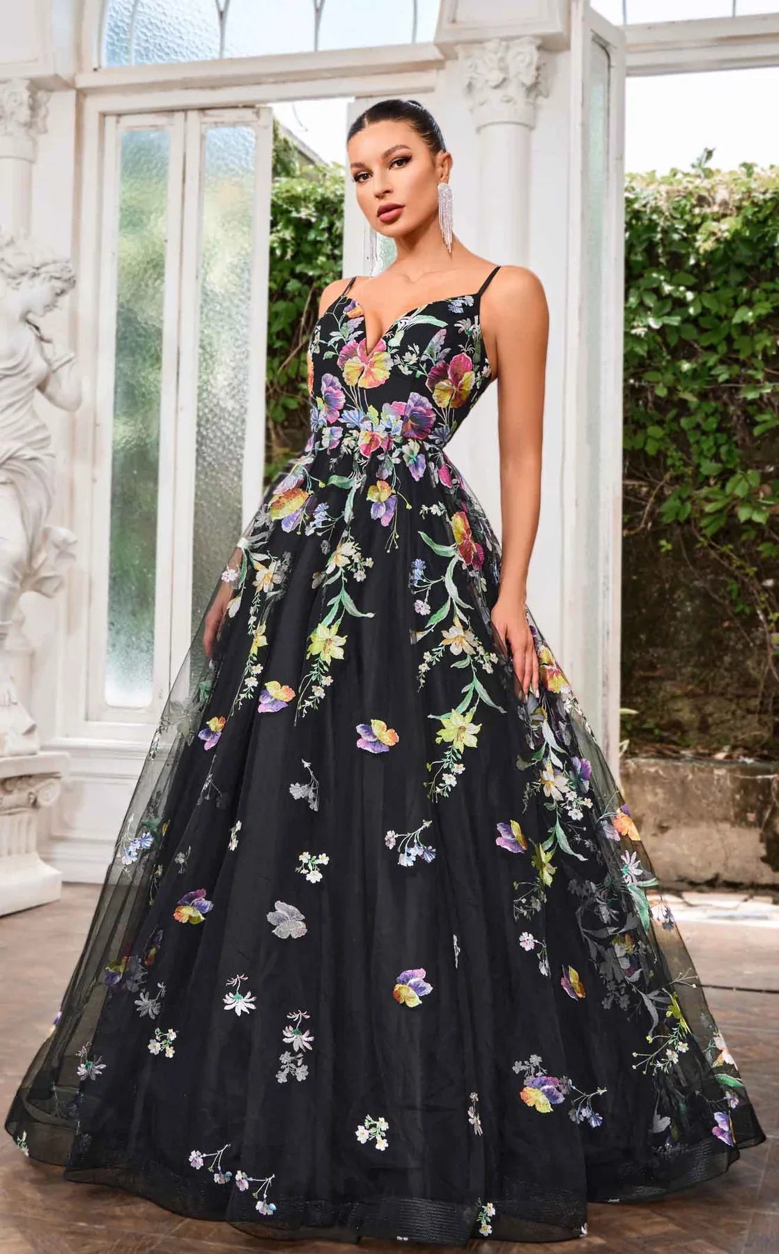 J24046 gown featuring a V-neckline and oversized floral designs on a flowing A-line skirt.