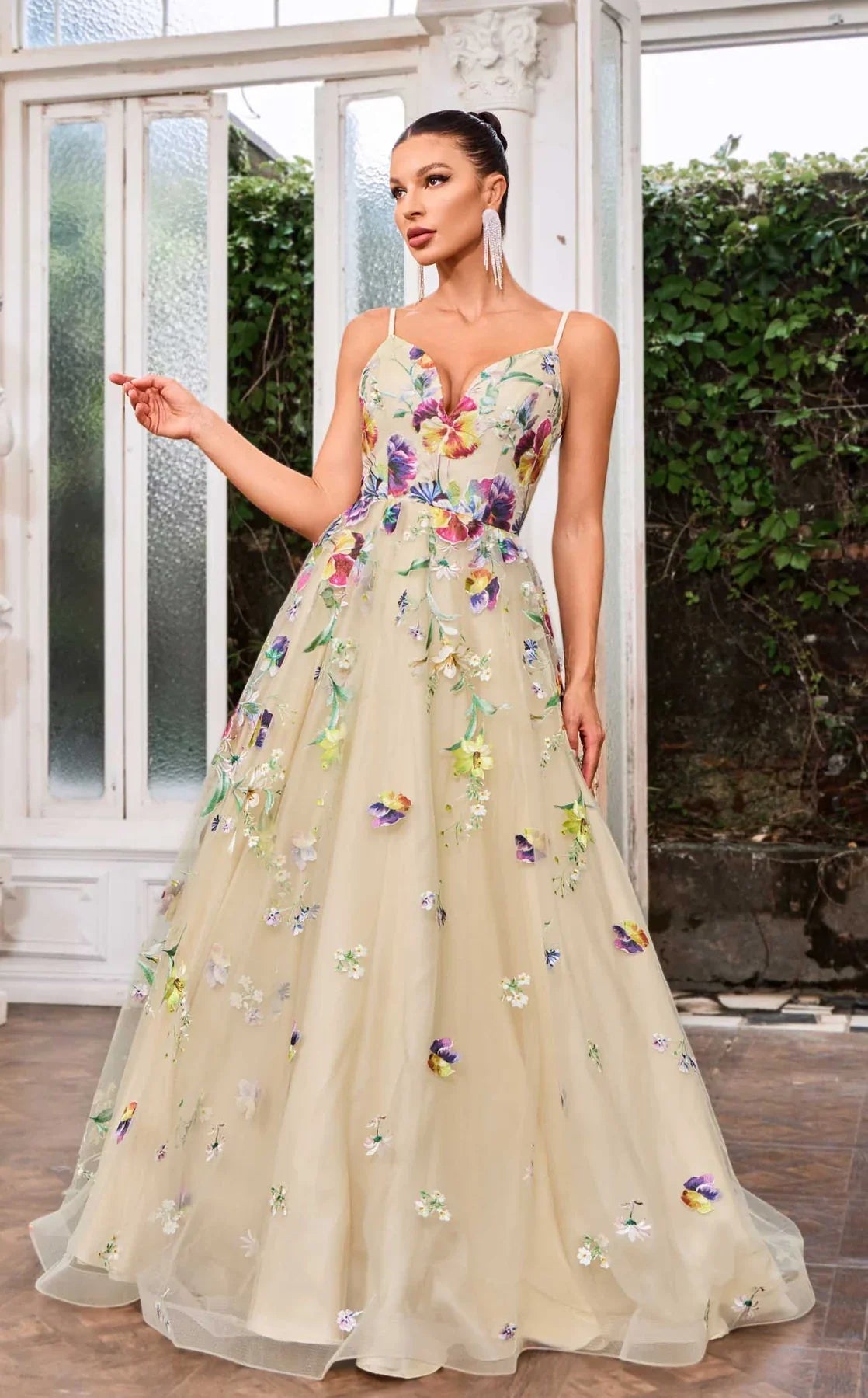 J24046 gown with a bold V-neckline and oversized floral designs on a flowing A-line skirt.