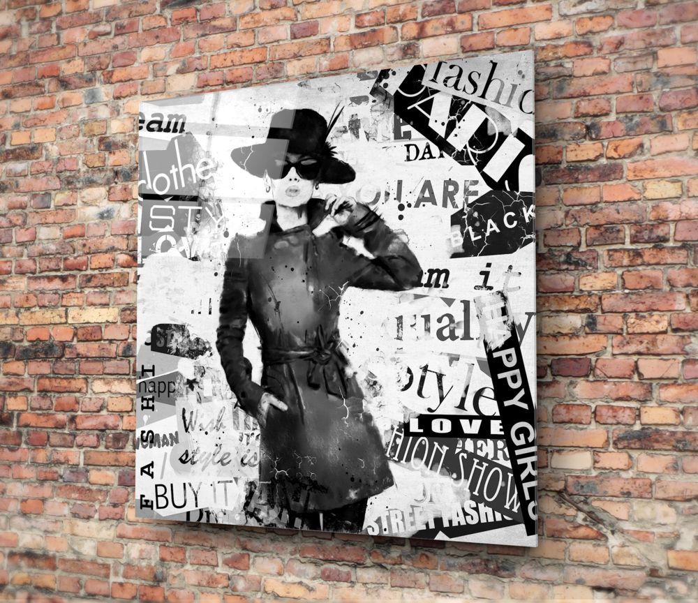 Fashion Glass Wall Art featuring a stylish woman in a chic outfit against a collage of fashion-related text.