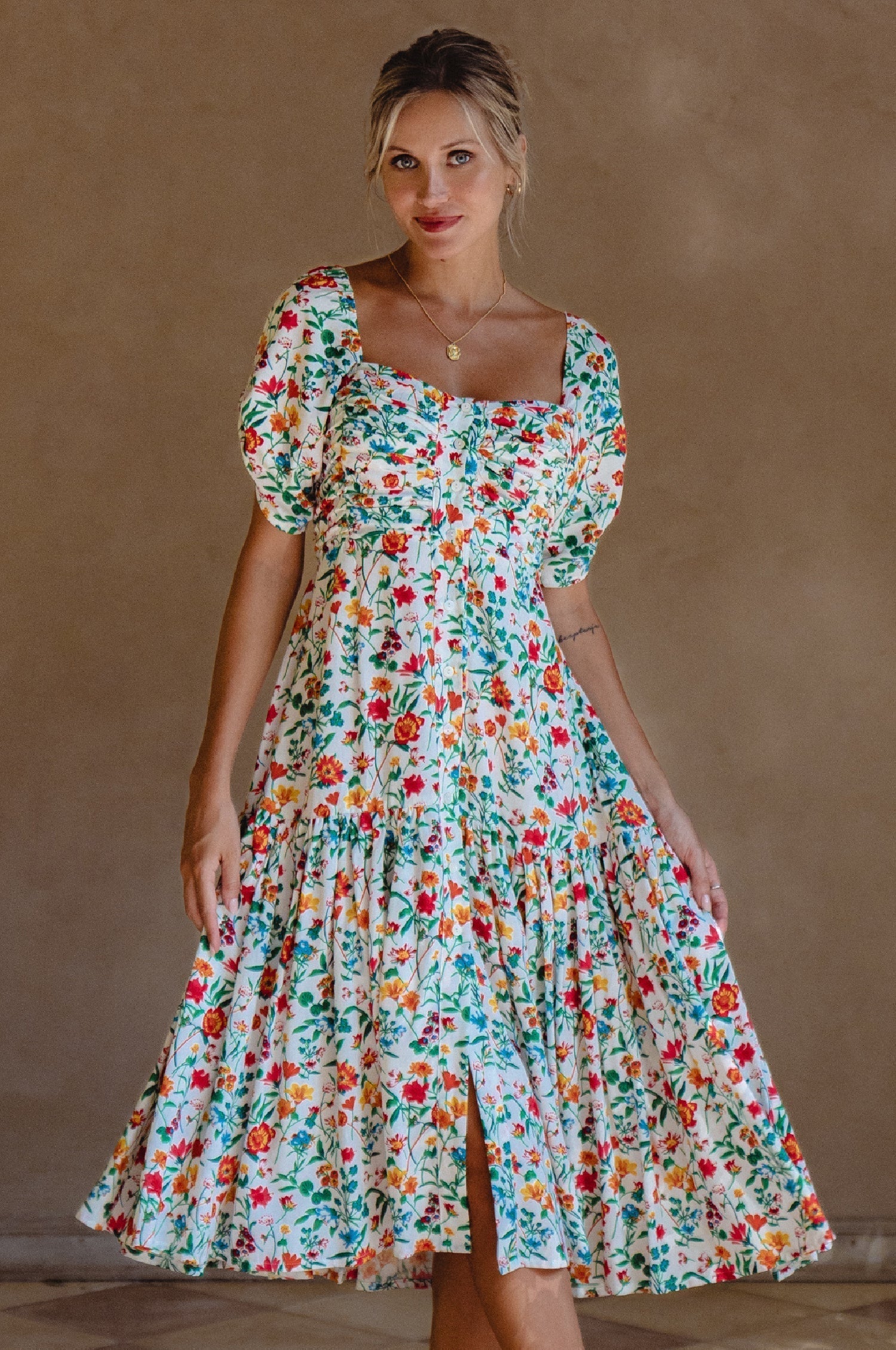 Lilit Midi Dress with floral print, puff sleeves, and gathered front for a feminine look, perfect for any occasion.