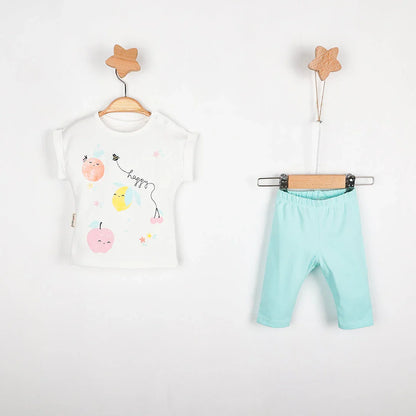 Happy Fruit Baby Girls Leggings Set of a t-shirt with fruit design and blue cotton leggings hanging on display.