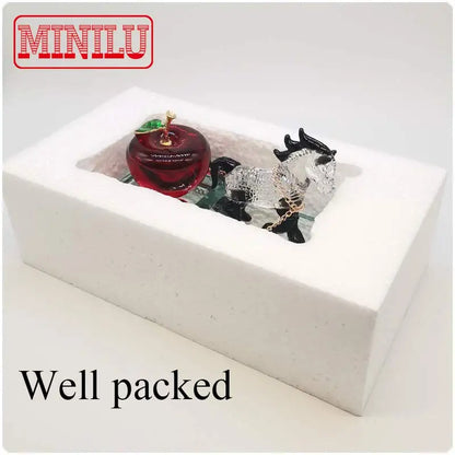 Crystal Perfume Seat Car Decoration Horse in a well-packed box with a red apple.