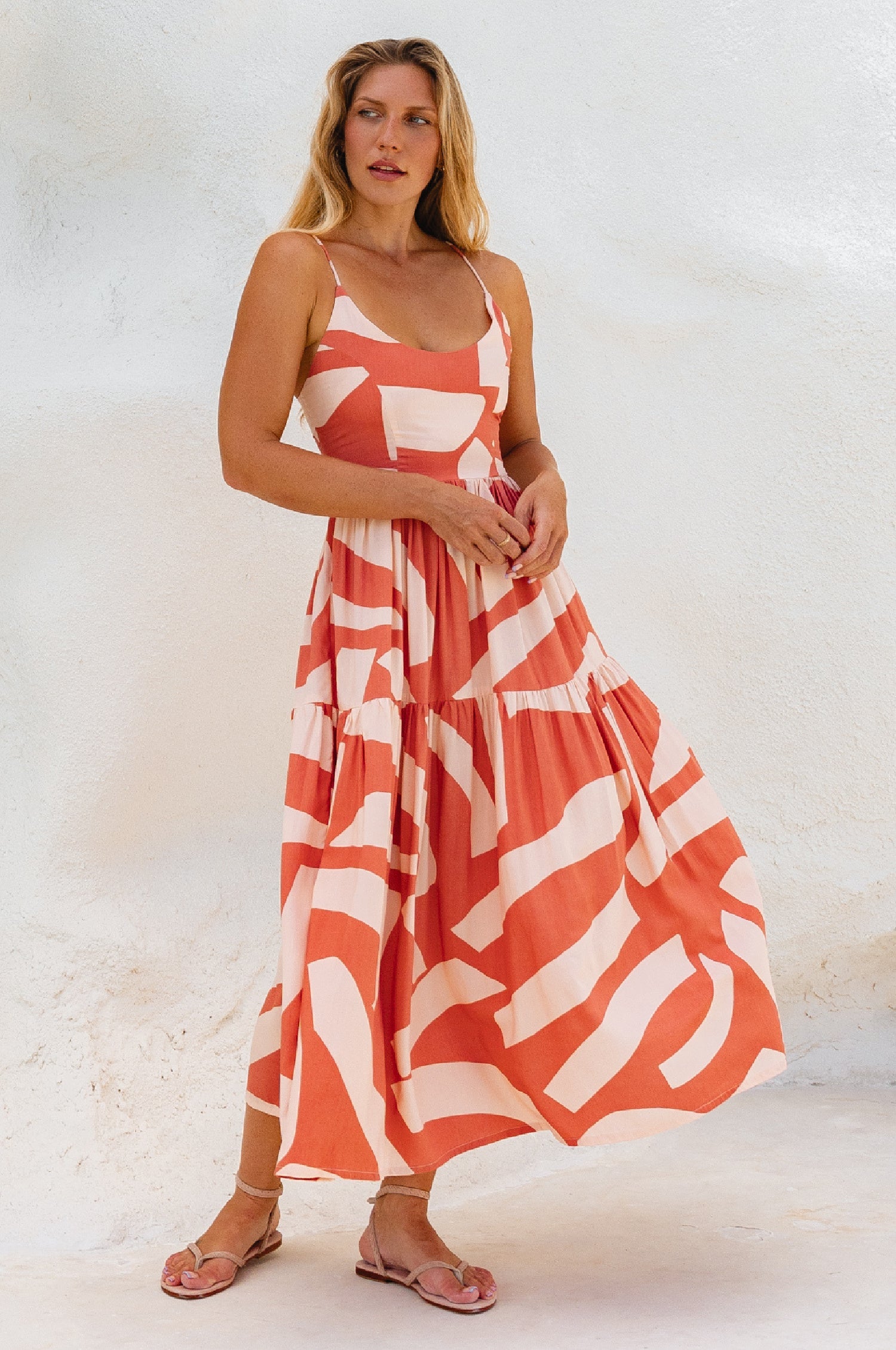 Sea Dreamer Strappy Midi Dress in coral and white print, featuring a voluminous skirt and scoop neckline.
