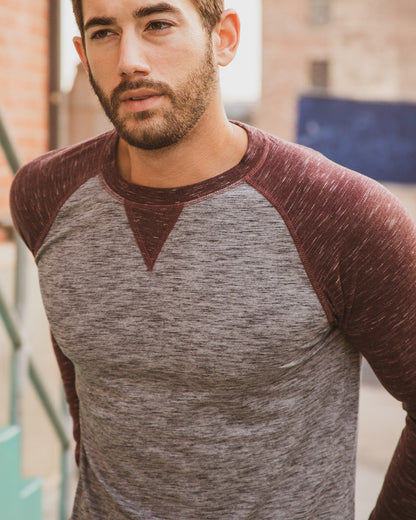 ZIMEGO Men Athletic Fit Baseball Retro Contrast Long Sleeve Raglan T-Shirt worn by a model outdoors, showing its slim athletic fit.