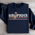 Girl Power Rose sweatshirt featuring vibrant graphics and cozy fleece for comfortable wear.