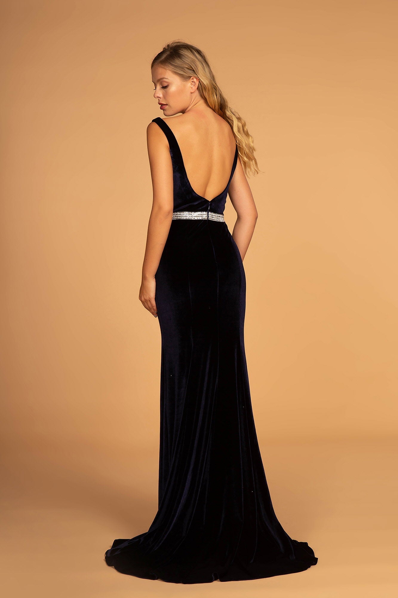 Jewel Accented Waist Line V-Neck Velvet Dress w/ U-Back showcasing an elegant open back and fitted velvet silhouette.