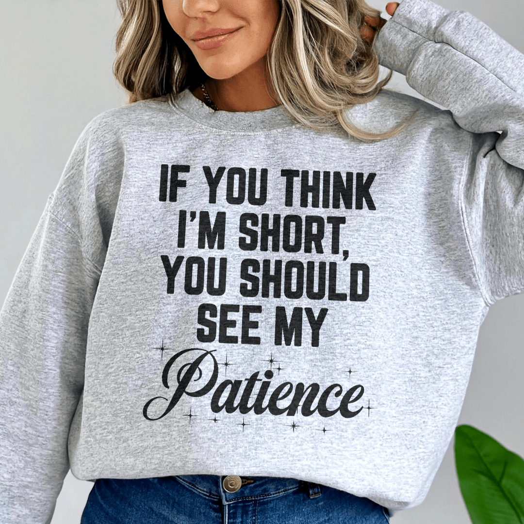 Woman wearing a cozy sweatshirt that says &