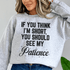 Woman wearing a cozy sweatshirt that says &