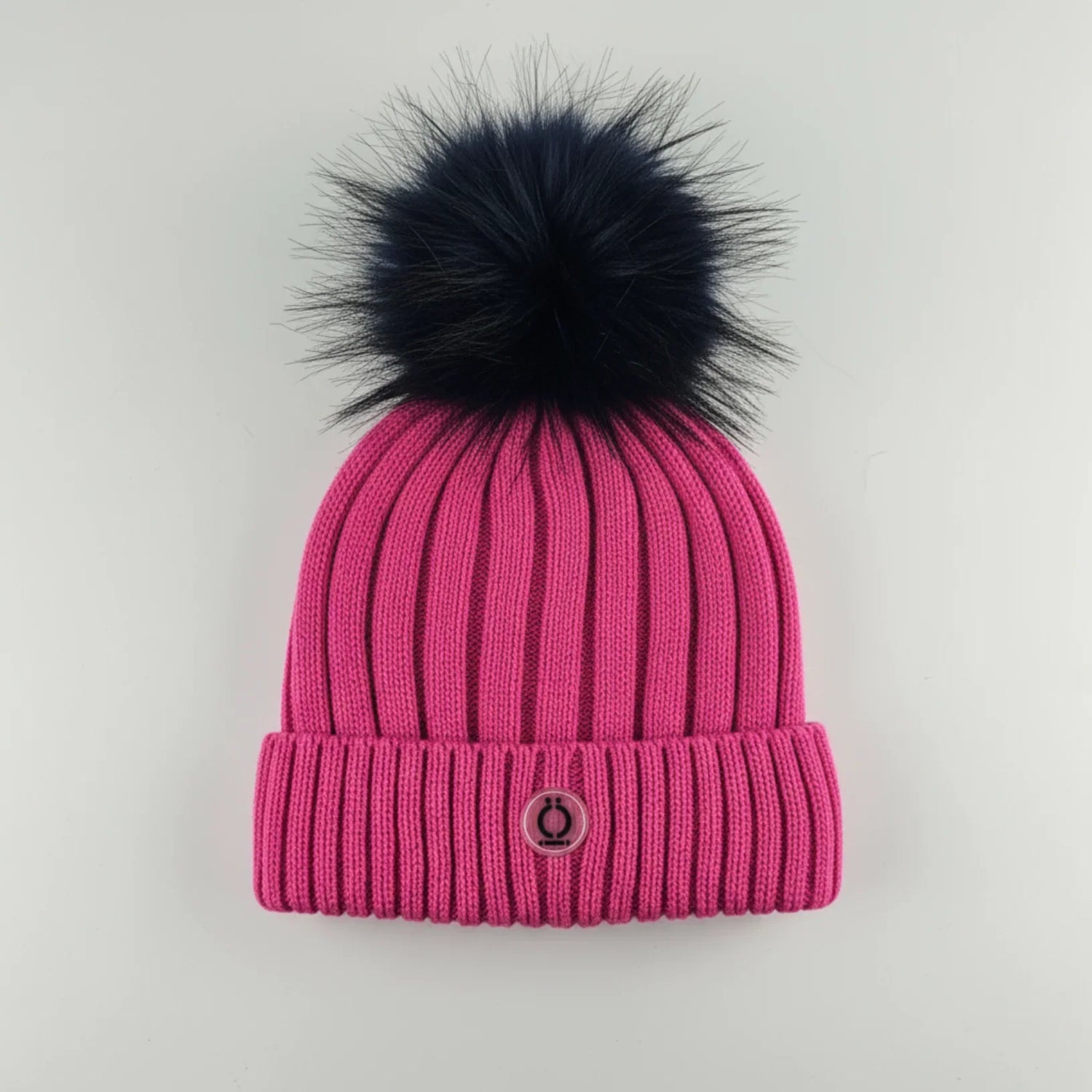 Fushia Tuque with removable black fur pompom and polar fleece lining for comfort and warmth.