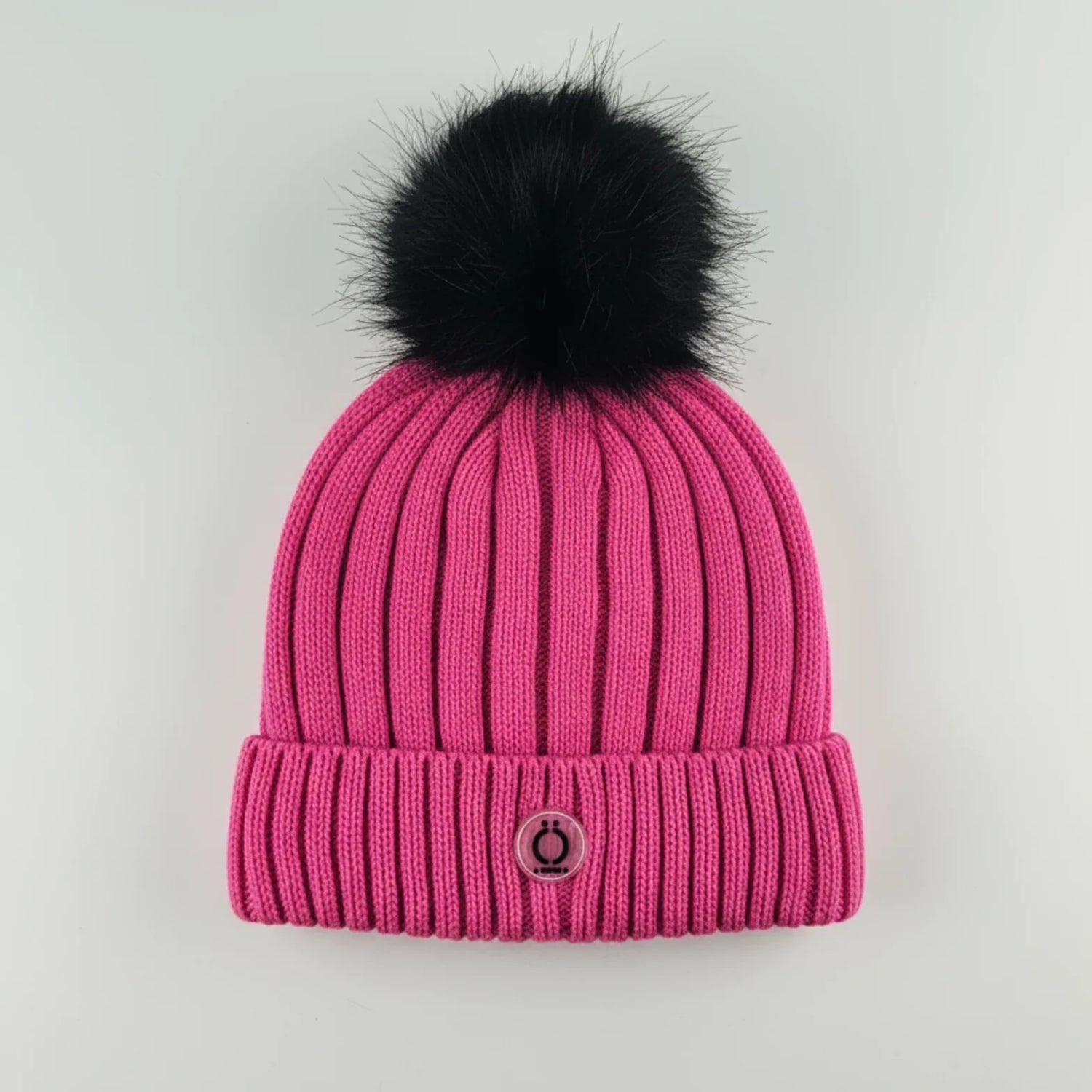 Fushia Tuque featuring a soft long fur pompom and warm polar fleece lining.