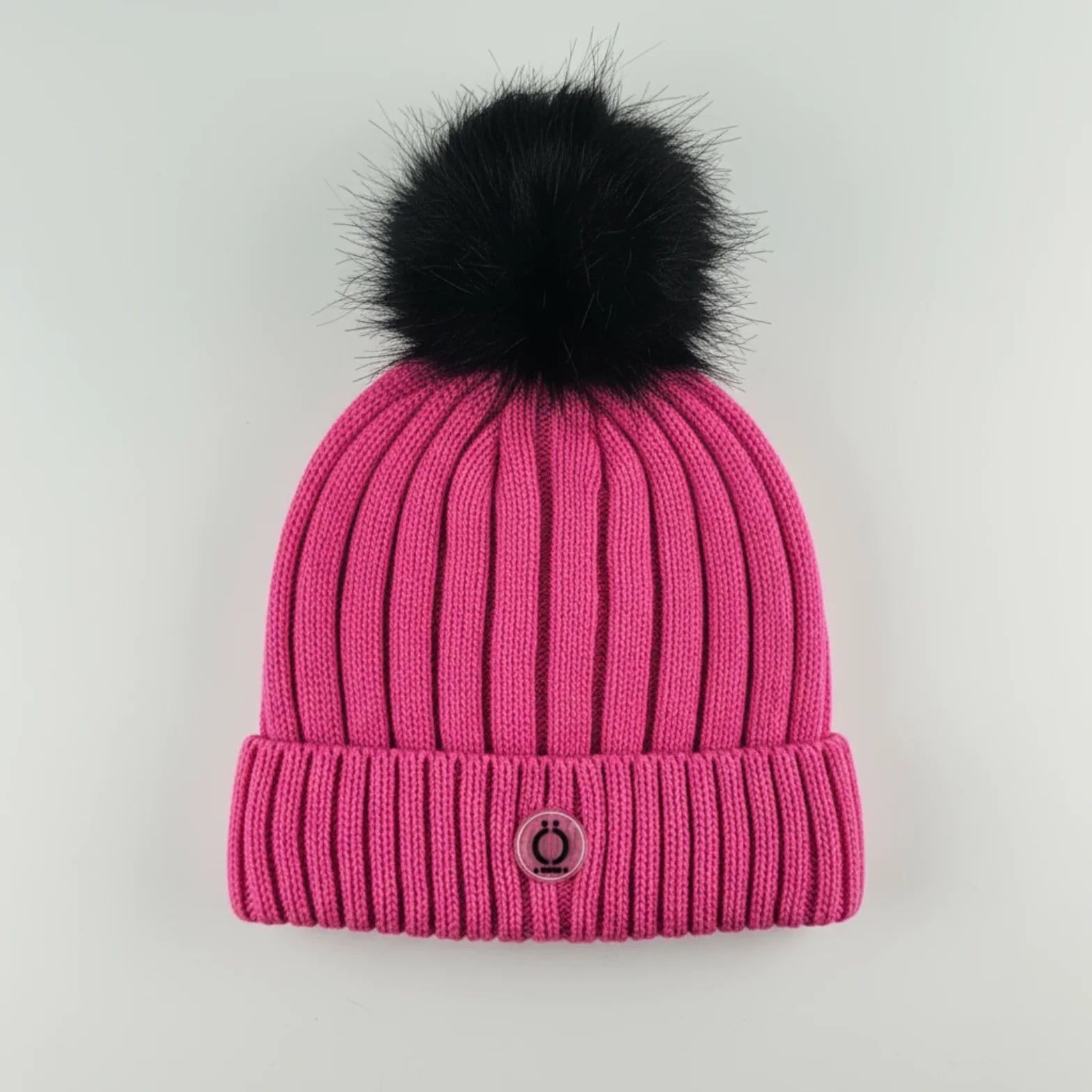 Fushia Tuque featuring a soft long fur pompom and warm polar fleece lining.