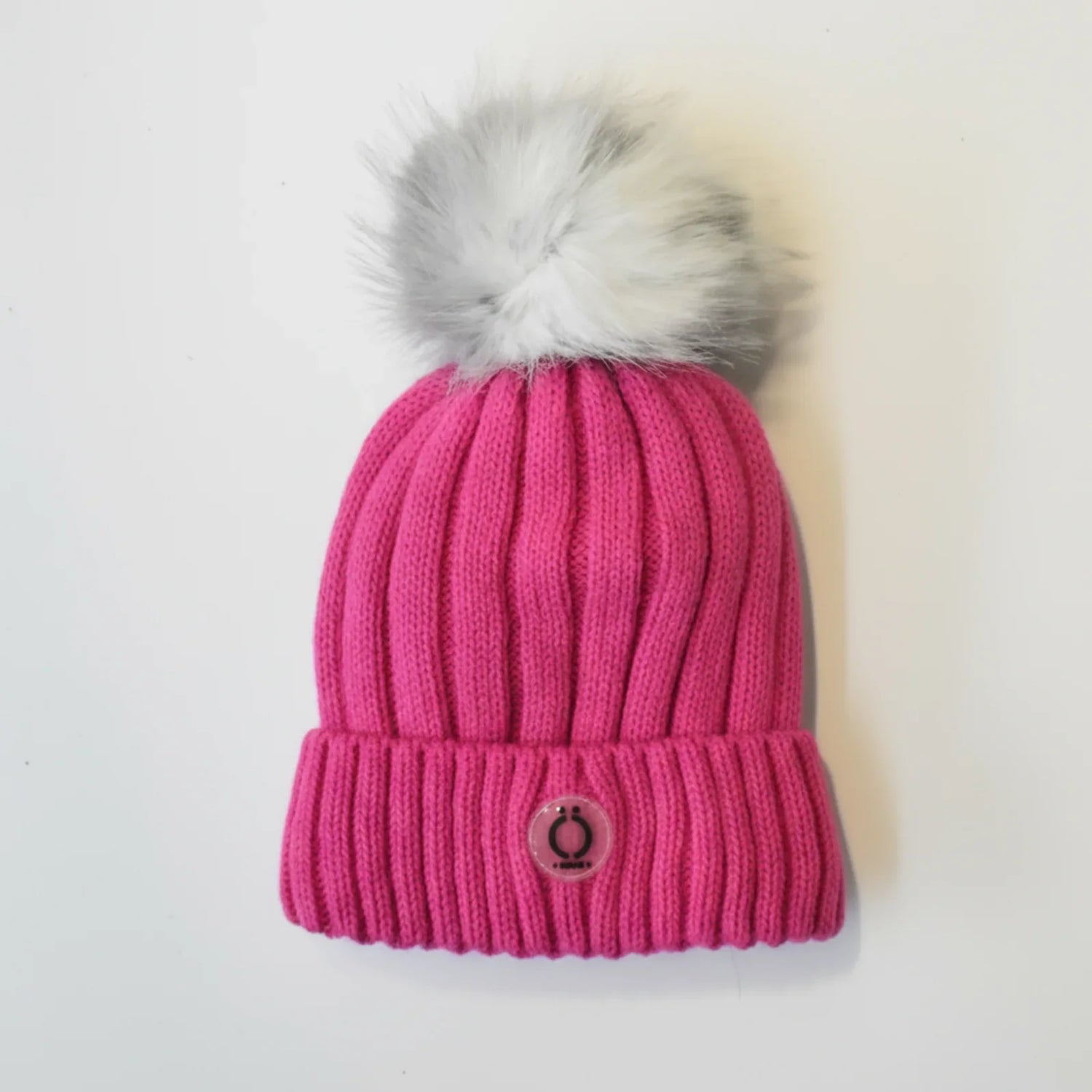 Fushia Tuque with soft fur pompom and polar fleece lining, perfect for stylish winter wear.
