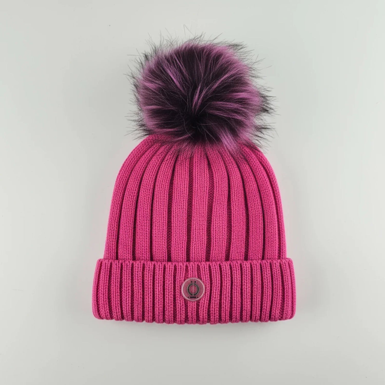 Fushia Tuque with removable pompom and polar fleece lining, perfect for warmth and style.