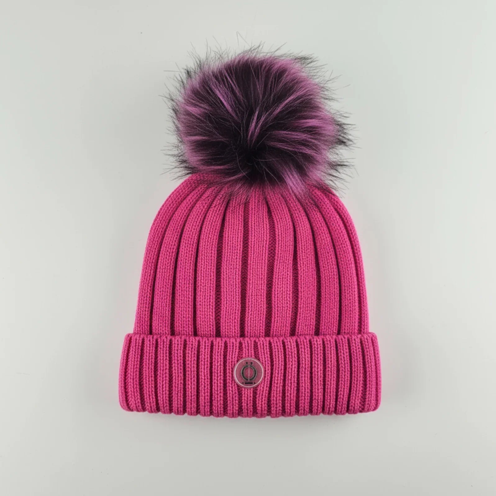 Fushia Tuque with removable pompom and polar fleece lining, perfect for warmth and style.