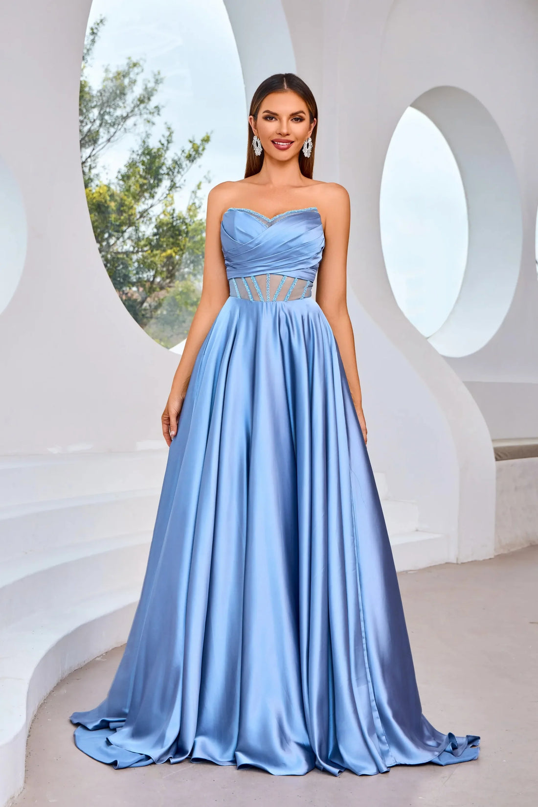 J25007 dress featuring a strapless design and illusion sweetheart neckline in powder blue fabric.