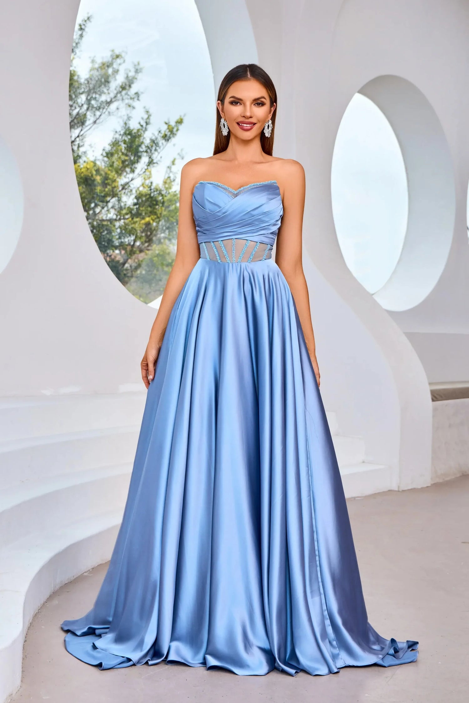 J25007 dress featuring a strapless design and illusion sweetheart neckline in powder blue fabric.