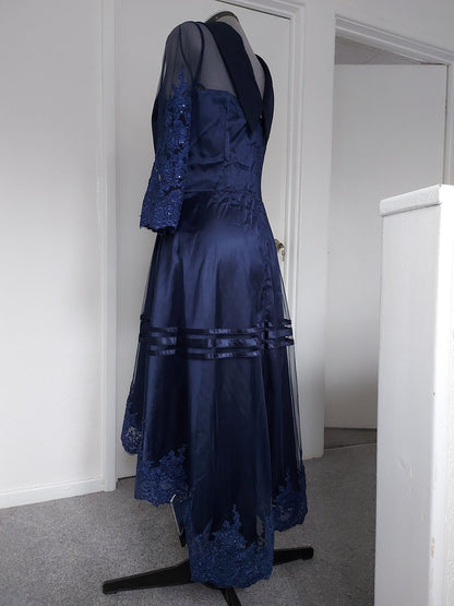 The midnight fold collar high-low mum dress showcasing the elegant navy blue design and asymmetrical hem.