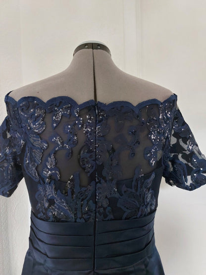 Navy blue lace appliqued knee length bridal dress back view showcasing intricate lace detailing.