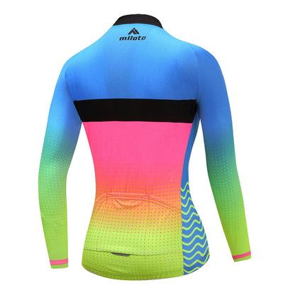 Women Long Sleeve Thermal Fleece Cycling Clothing in vibrant blue, pink, and green colors, showcasing a sporty design.