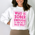 Woman smiling in a white sweatshirt with text &