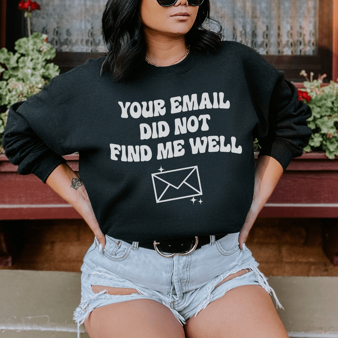 Model wearing a black sweatshirt with the text &